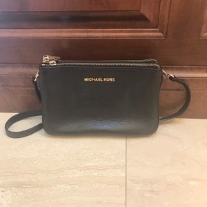 Three pocket black leather Michael Kors crossbody